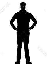 One business man standing hands on hips silhouette