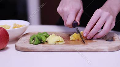 Cut orange into slices. Preparing fruit salad