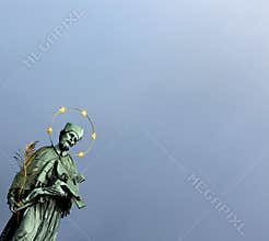 Religious figure with cross of Christ and olive branch