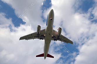 White plane and clouds