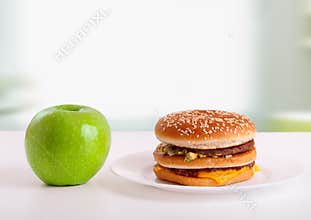 Healthy, unhealthy food. Diet concept: apple, ha