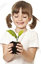 Little girl with plant in her hands