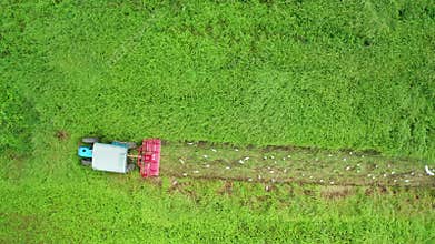 Aerial view of farmland and Combine harvester