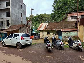 Stock photo of old residencial area of Indian city, old style house with clay mad roof top, green