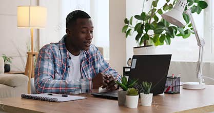 Man using laptop for video conference at office