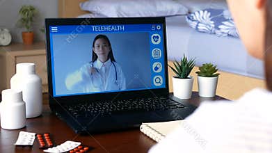 Deaf mute patient use remote distance video conference, make online consultation by sign language with doctor on laptop about illn
