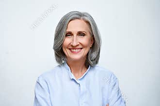 Smiling mature business woman isolated on white background, headshot portrait.