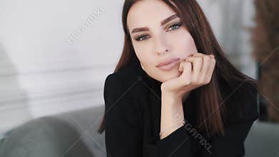 Close-up portrait of beautiful successful young caucasian businesswoman