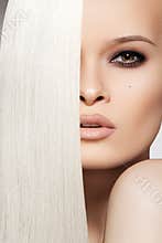 woman with beautiful long blond hair & makeup