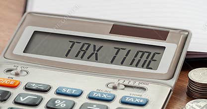 Tax Time word on calculator. Business and tax concept. Time to pay tax in year.