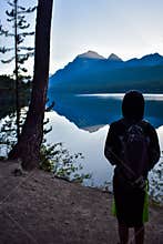 Boy Looking at Mountain Lake
