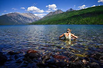 Girl Swimming in Mountain Lake