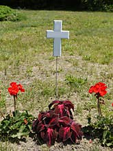Gravestone: floating white cross