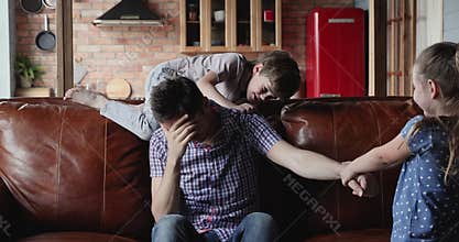 Sluggish dad feels exhausted to play with active kids