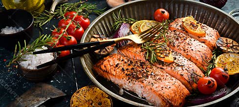 Baked Salmon with rosemary, lemon and vegetables. Recipe. Seafood. Side view