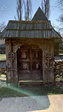 Bucharest Village Museum wooden gate - old peasant houses from different geographic areas of Romania