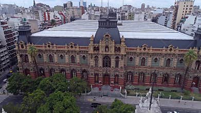 Aerial view of the city of Buenos Aires with tall buildings and green parks.