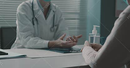 Doctor and senior patient talking together in the office