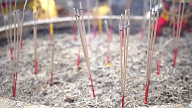 Burning incense sticks with smoke at Chinese traditional temple and Buddhism temple