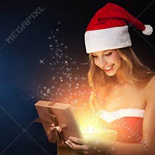 Beautiful christmas woman open fairy gift