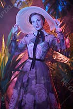 Lady in tropical greenery
