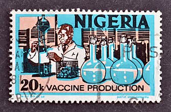 Cancelled postage stamp printed by Nigeria, that shows vaccine production