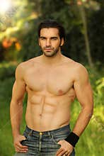 Outdoor portrait of a shirtless good looking ma