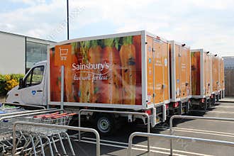 Sainsburyâ€™s Delivery Vehicles Fleet in a Car Park