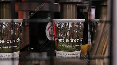Automatic disposal coffee paper cup making machine during work at exhibition