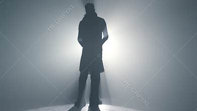 Silhouette loving pair having date indoors. Romantic couple enjoying dance.