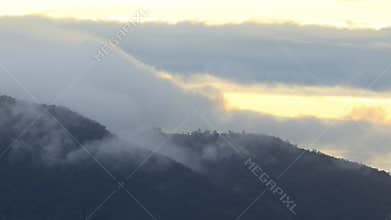 Mist flowing through the mountain valley at Chiang Kam Mountain, Chiangmai, Thailand