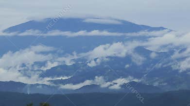 Mist is flowing through the mountain valley at Chiang Kam Mountain, Chiangmai, Thailand