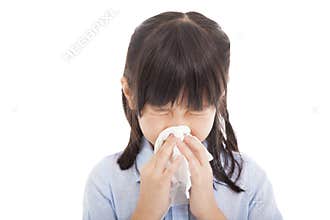 Little girl blows her nose