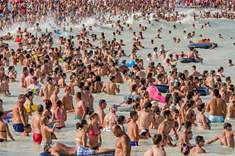 Very Crowded Beach Full Of People