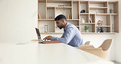 Serious young Arab entrepreneur man focused on online business communication