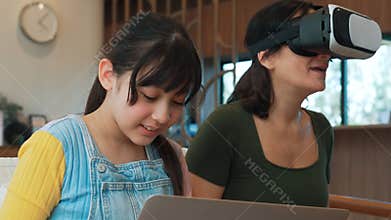 Granddaughter guide grandmother to dive in metaverse with VR. Divergence.