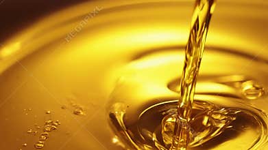 The smooth and luxurious texture of liquid gold oozes out of a bottle promising ultimate indulgence..