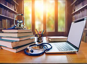 Study Desk with Stacks of Books and Stethoscope: Symbol of Medical Education and Medical Research
