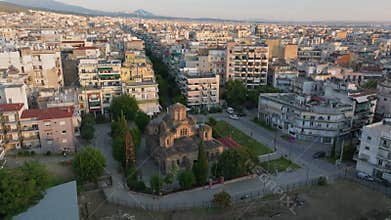 Aerial views of Thessaloniki, Greece, showcase a vibrant cityscape. The camera pans over Church of Holy Apostles and