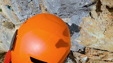 Point of view of a mountaineer climbing a via ferrata. Extreme sports POV