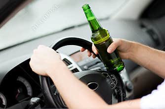 Man drinking alcohol while driving the car