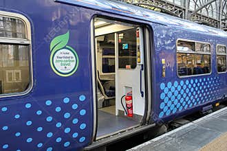 Zero Carbon Electric Train With Open Doors in Glasgow
