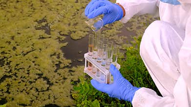 Taking water samples in nature. Selective focus.