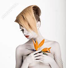 Fantasy. Artistry. Futuristic Woman with Yellow Flower. Trendy Coiffure, Bodyart Make-up