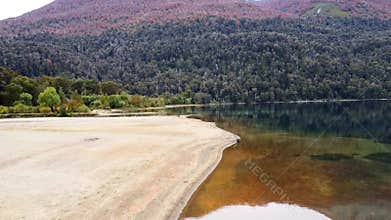 Aerial shore view of unique blue mineral colored lake