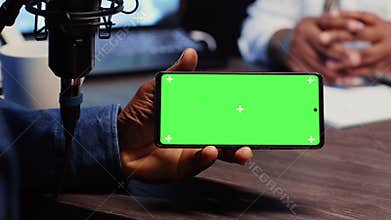 Chroma key smartphone running videos for podcasters to react to