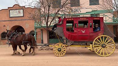 Horse and carriage going through the town of Tombstone Arizona.
