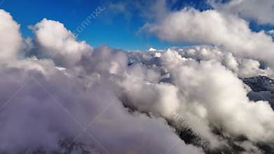 Flying through the clouds with a first-person view. Time lapse aerial view of weather changes high above the ground