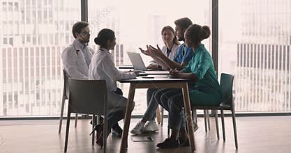 Multiethnic team of doctors discussing medical cooperation, teamwork