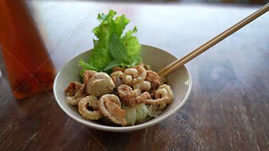 Spicy rice noodles soup with pork rind, Thai style food.